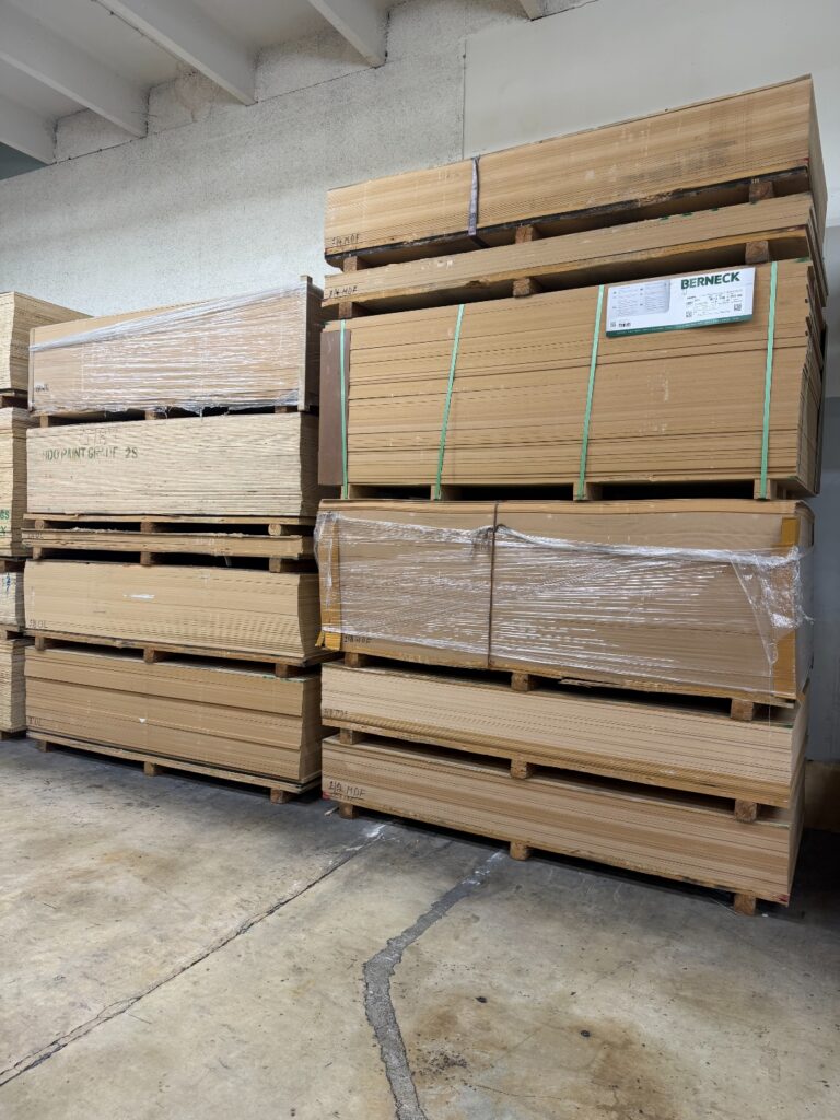 MDF board pallets stacked in Doral warehouse — International Plywood & Lumber