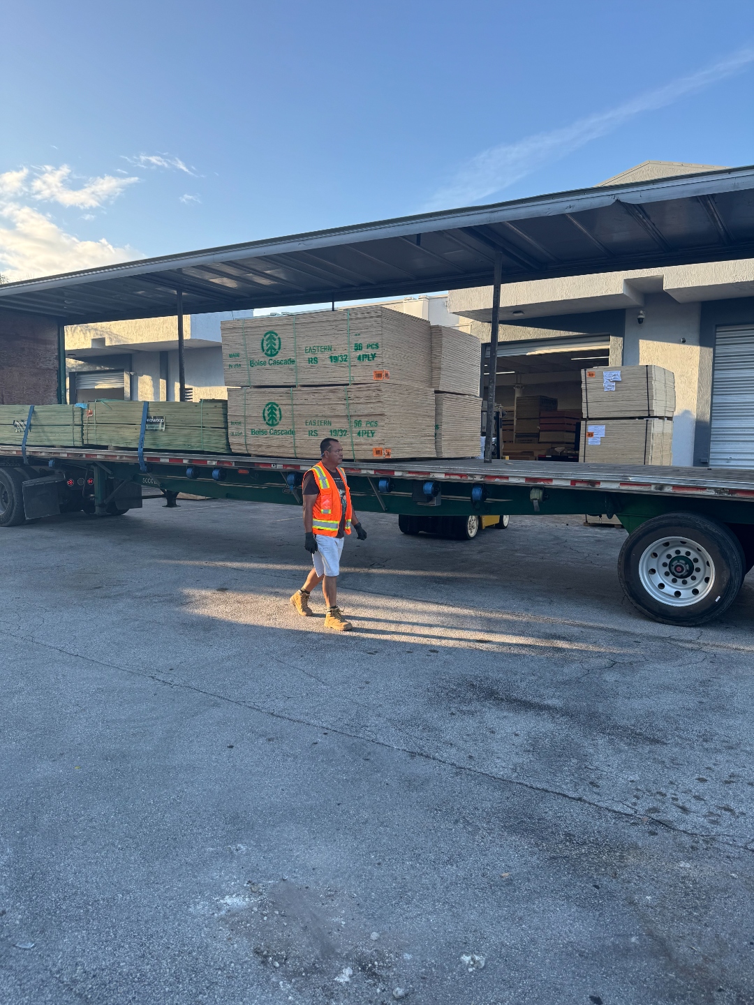 Boise Cascade 19/32 CDX plywood units being loaded on flatbed truck at International Plywood Doral FL